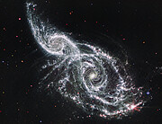 Galaxies IC 2163 and NGC 2207 (Webb MIRI image)